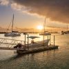 Sunset in Mauritius Grand Baie harbor with boats in foreground